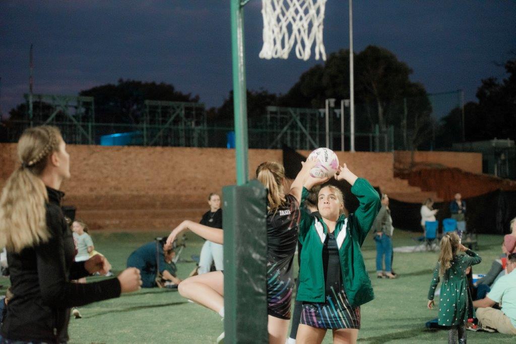 Girl shooting for netbal hoop